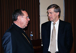 Archbishop Daniel M. Buechlein shares a moment with University of Notre Dame Law School Professor Matthew J. Barrett. Barrett was the keynote speaker at the Indiana Catholic Conference’s annual legislator luncheon on Jan. 16. (Photo by Charles Schisla) 