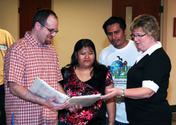 During an adult faith formation event on April 24 at St. Bartholomew Parish in Columbus, Kathy Davis-Shanks, right, a pastoral associate at the parish, speaks with, from left, Greg Andrews, who was received into the full communion of the Church at the parish at the Easter Vigil; Isabel Hernandez, a member of the parish; and her husband, Enrique Hernandez, who was also received into the full communion of the Church during the Easter Vigil. (Submitted photo)