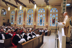 Father John Hollowell reflects on joy during his first year as a priest during the close of a 40 Hours devotion on March 10 at Our Lady of the Most Holy Rosary Church in Indianapolis. The reflection was part of Holy Rosary’s 10th annual “Spaghetti and Spirituality” Lenten adult educational series. (Photo by Sean Gallagher)