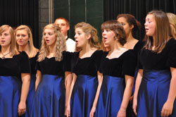 Choir members from Roncalli High School in Indianapolis sing during the 60th anniversary celebration for Our Lady of Fatima Retreat House on Oct. 23 at the Northside Knights of Columbus Hall in Indianapolis. Band members from Brebeuf Jesuit Preparatory School in Indianapolis also performed during the event. (Photos by Mary Ann Wyand)