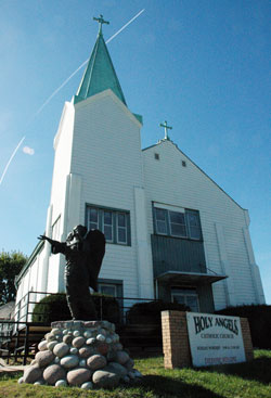 Since 1903, Holy Angels Church has been a beacon of hope and faith in its Indianapolis neighborhood. Because of structural problems and health concerns, the church will be closed after the parish’s annual fall revival ends on Oct. 11. The parish hopes to eventually build a new church on the same hilltop site. (Photo by John Shaughnessy)