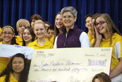 Benedictine Sister Mary Nicolette Etienne smiles with joy after her eighth-grade religion students at Holy Name of Jesus School in Beech Grove surprised her on Dec. 7 with a trip to Lourdes, France—the dream trip she has wanted to take ever since she heard the story of the promise that her mother made to God there as a young woman. (Photo by John Shaughnessy)