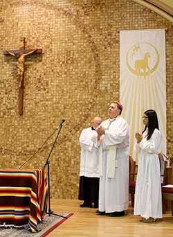 Archbishop William E. Lori laughs during a homily with members of his eighth-grade graduating class and their spouses during a July 18 Mass at a Knights of Columbus hall in New Albany. Archbishop Lori graduated from Our Lady of Perpetual Help School in New Albany in 1965. (Photo by Sean Gallagher)