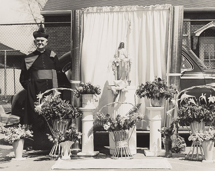 This photo shows a flag raising event at St. Mary School in North Vernon. Though no date is given on the photo, it could depict celebrations related to the dedication of the school building by Bishop Denis O’Donoghue, former auxiliary bishop of Indianapolis, on June 21, 1908. St. Mary Parish was founded in 1861, and the school continues to operate in the building shown in this photograph.