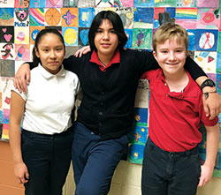 Jennifer Cazares, Waldo Tapia and Lance Gratner have taken the initiative to lead the student choir and musicians during the weekly school Mass for students at St. Anthony School in Indianapolis. (Submitted photo)