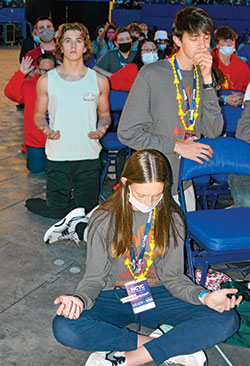 Youths pray during eucharistic adoration on Nov. 19 in Lucas Oil Stadium in Indianapolis during the National Catholic Youth Conference. (Photos by Natalie Hoefer)