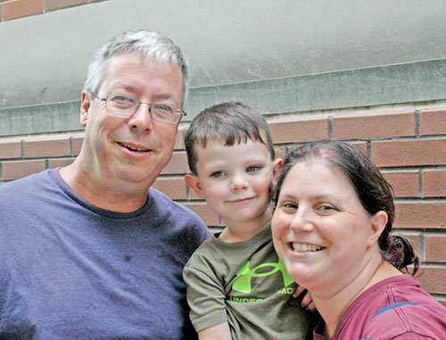 Ed and Joanne Portzer of the Diocese of Youngstown, Ohio, came to Indianapolis for the National Eucharistic Congress wanting their 3-year-old son Daniel “to see so many people loving Jesus.” (Photo by John Shaughnessy)