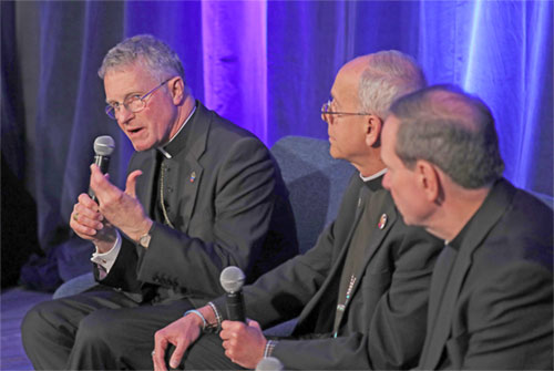 Archbishop Timothy P. Broglio of the U.S. Archdiocese for the Military Services, president of the U.S. Conference of Catholic Bishops, speaks during a news conference at a Nov. 12, 2024, session of the fall general assembly of the USCCB in Baltimore. Also pictured are Bishops Mark J. Seitz of El Paso, Texas, and Michael F. Burbidge of Arlington, Va. (OSV News photo/Bob Roller)