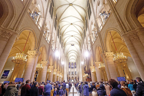 People attend a Mass open to the public at Notre Dame Cathedral in Paris on Dec. 8, five-and-a-half years after a fire ravaged the Gothic masterpiece. (OSV News photo/Christian Hartmann, Reuters)