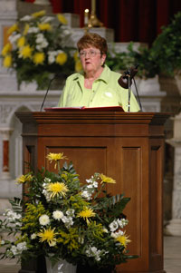 A lay person reading during Mass